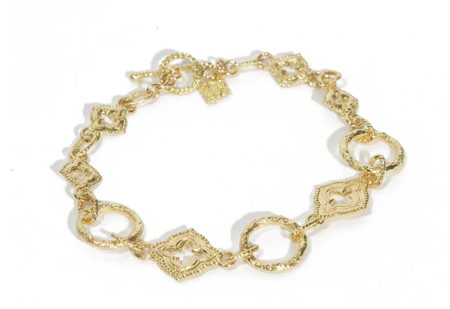 gold bracelet with multiple details around the band