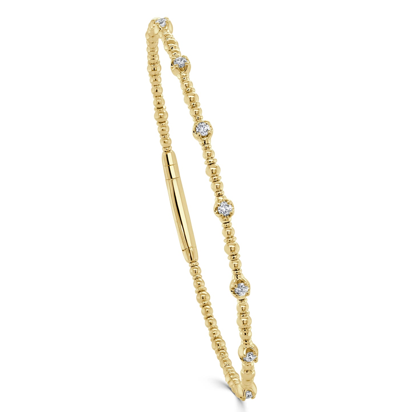 gold bangle with a few diamonds around