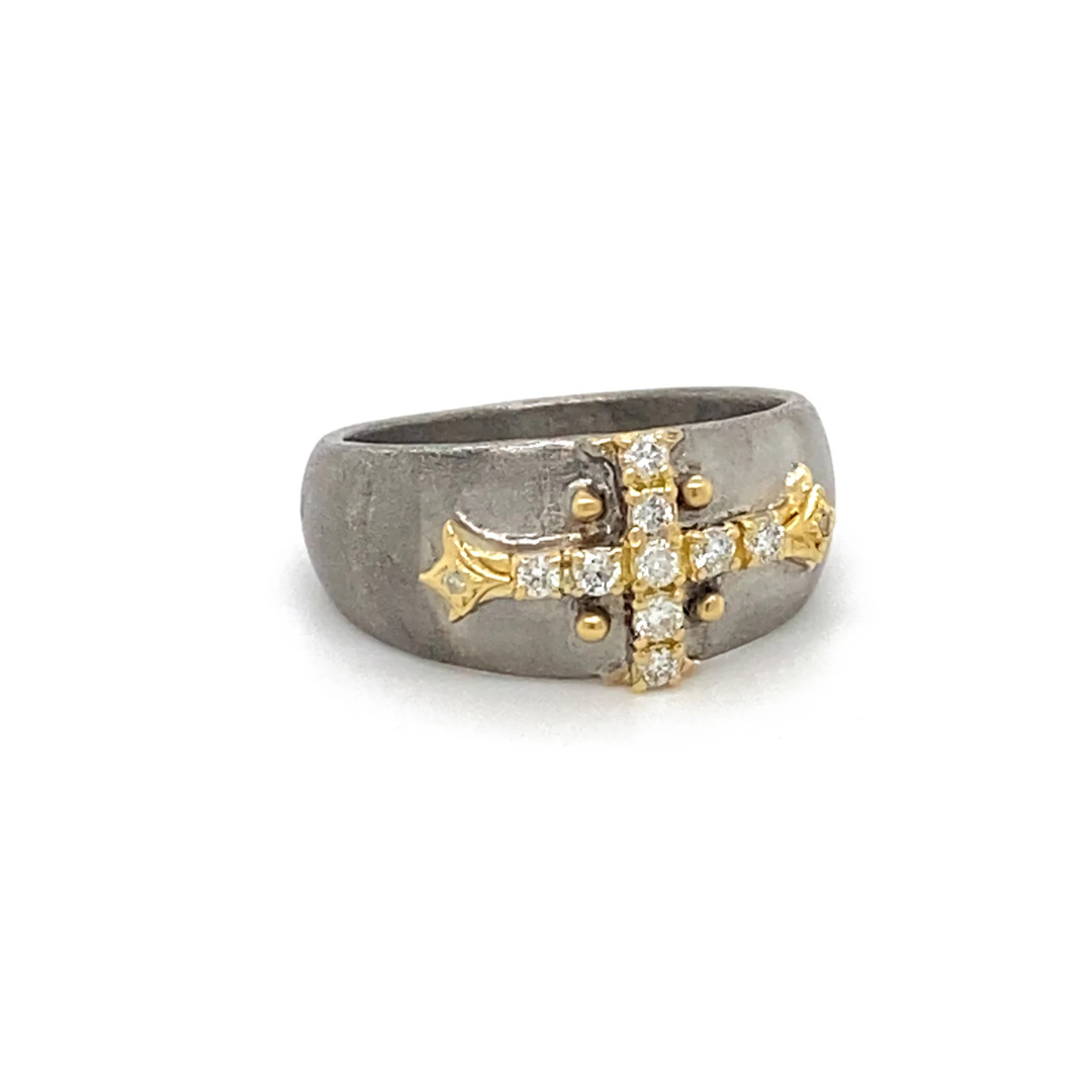 thick sterling silver ring with a gold and diamond cross