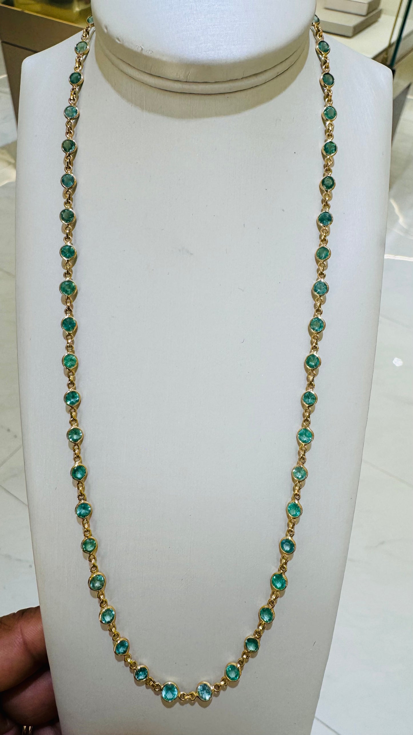 necklace is on a stand fake model