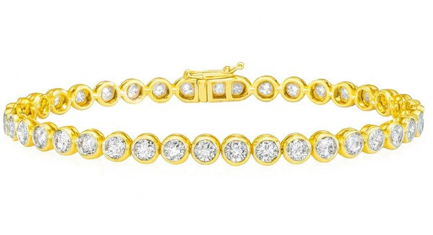 Gold bracelet with diamonds on a white background