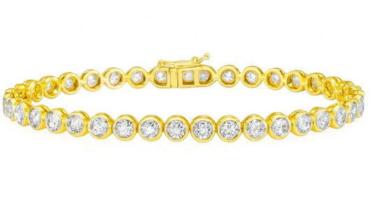 Gold bracelet with diamonds on a white background
