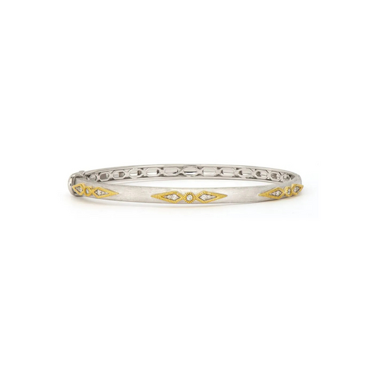 silver bangle with diamonds and gold accents around the diamonds