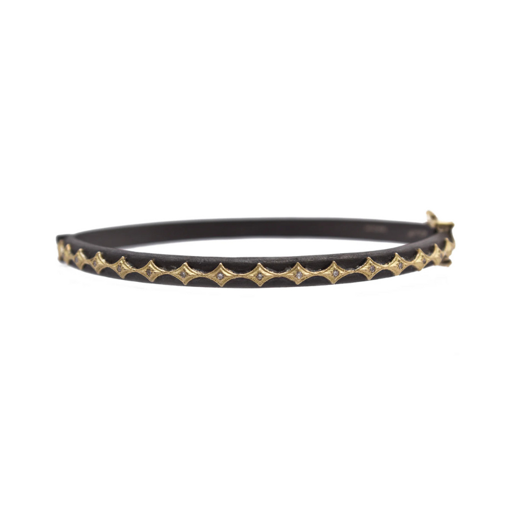 black colored bracelet with gold accents