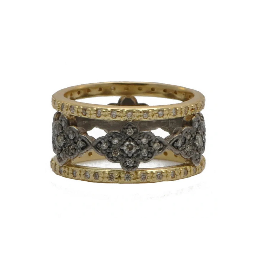 gold ring with diamonds in the middle with sterling silver