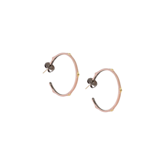 nude colored earrings with gold accents