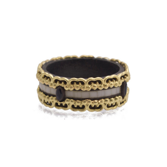 gold ring with gold patterns on the side