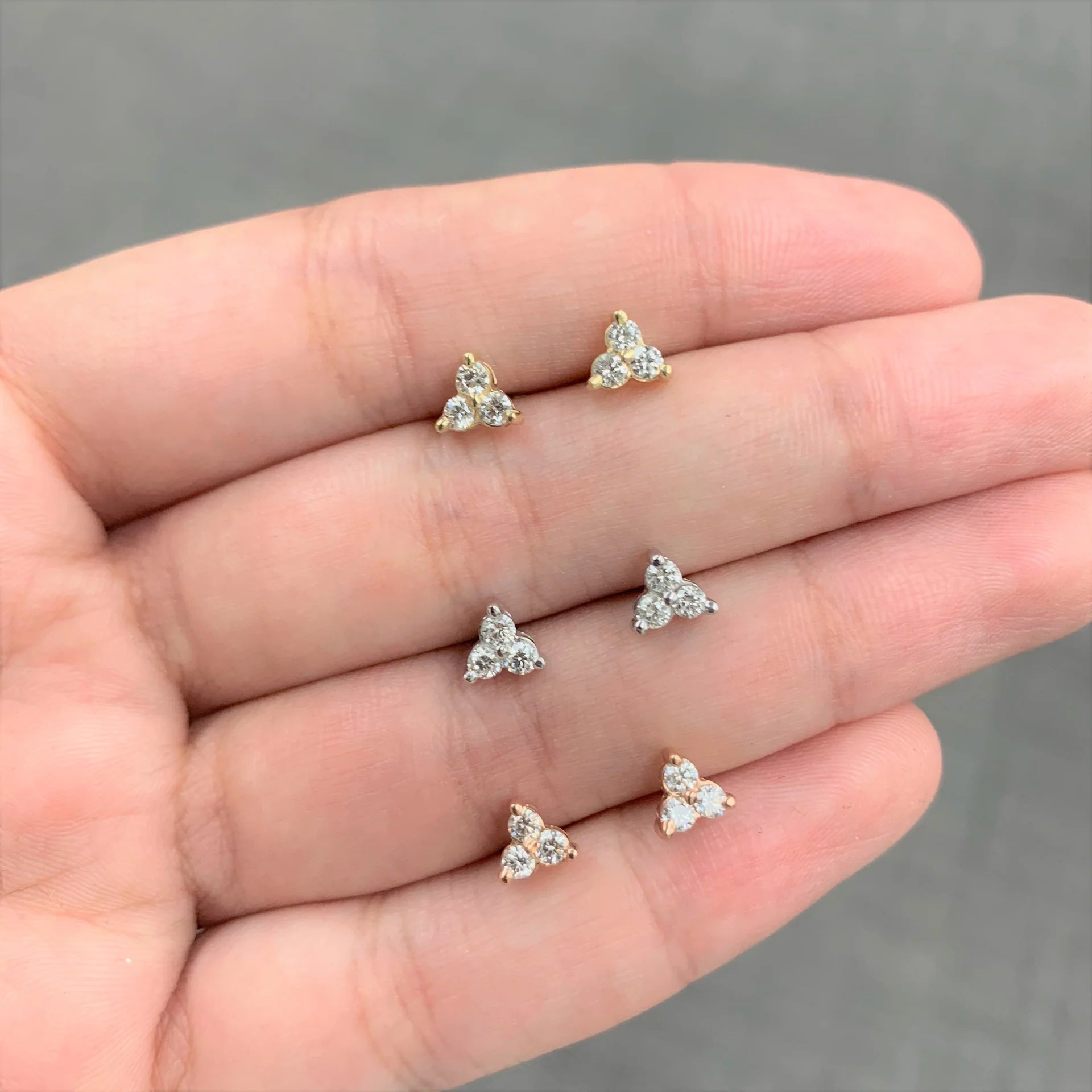 Stud earrings on a hand 