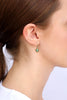 person wearing the gemstone earring