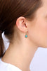 model wearing turquoise drop earring