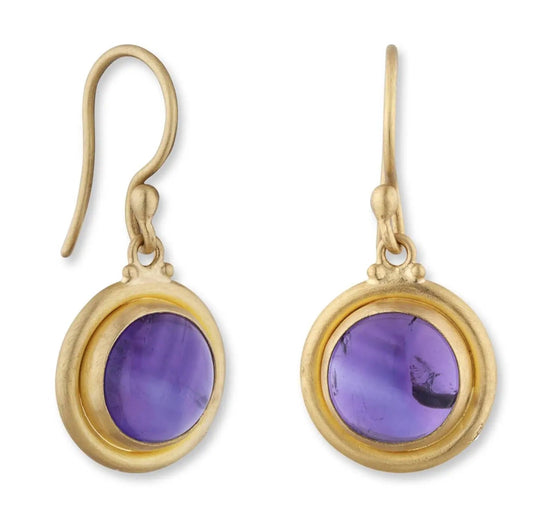 Gold earrings with purple gemstones on a white background