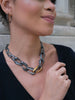 model wearing earrings and matching necklace