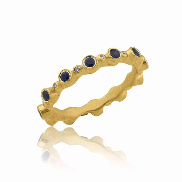 gold band and with blue gemstones