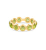 green colored gemstone ring with gold band