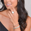 model wearing silver bangles and ring