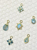 multiple charms made of multiple types of gemstones