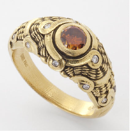 think gold ring with a center stone and small diamonds surrounding