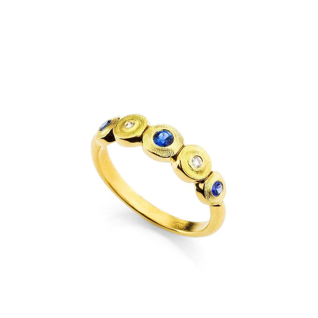 gold band with blue sapphires and diamonds