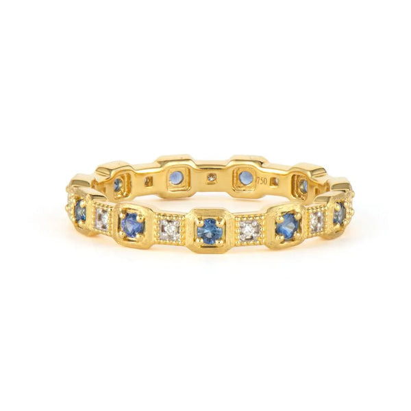 gold band with gemstones and diamonds around