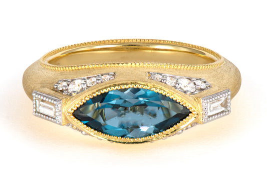 gold ring with blue topaz