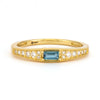 blue gemstone gold ring with diamonds on the side