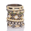 stack of gold and gemstone rings