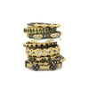 gold and gemstone rings stacked on top of each other