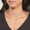 model wearing gold necklace with kite shaped diamonds