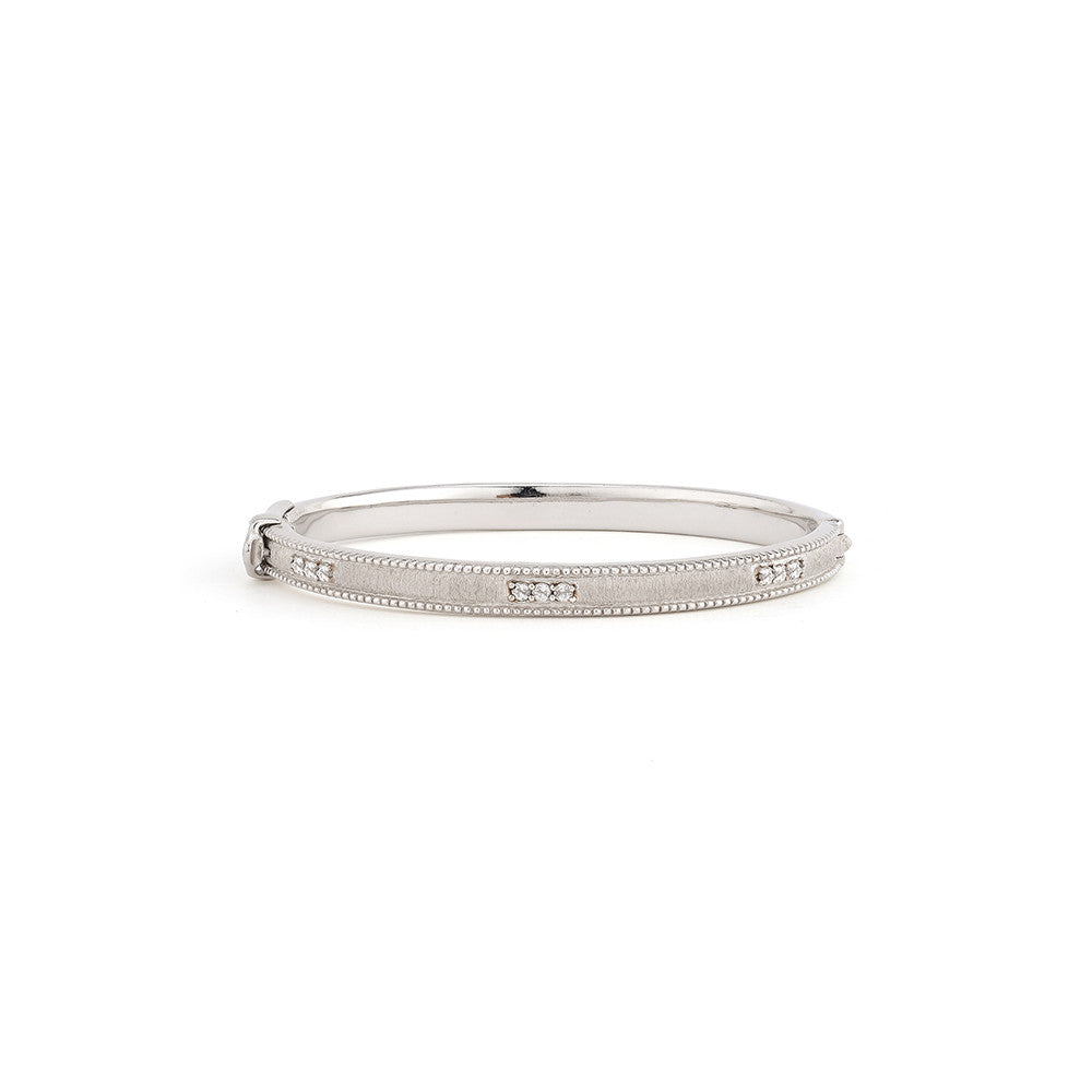 silver bangle with diamonds in three around the band