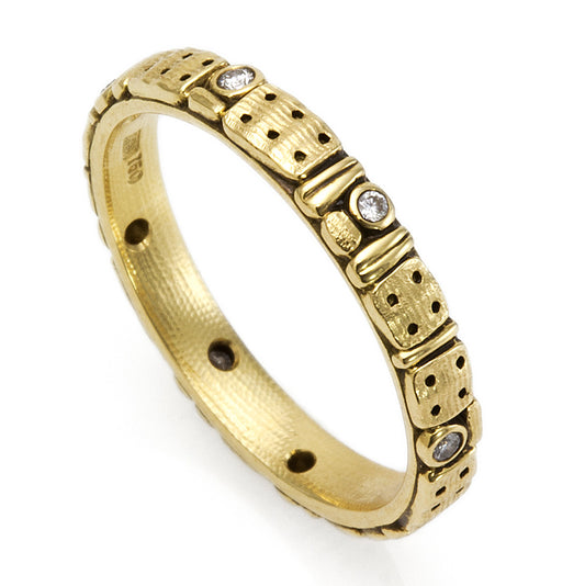 gold and black band with some diamonds on it